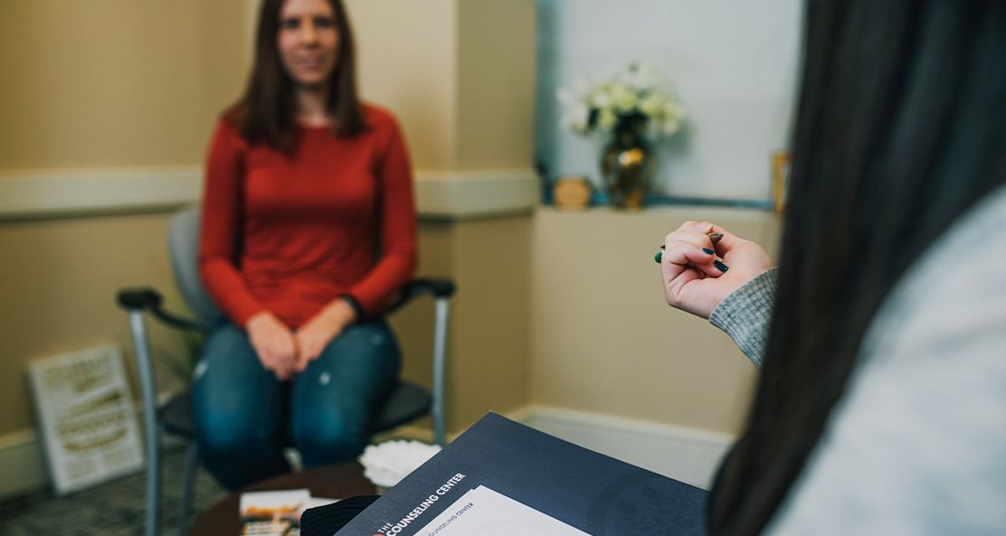 a therapy session with two women in an office talking